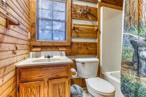 a bathroom with a toilet and a sink at Almost Heaven in Townsend