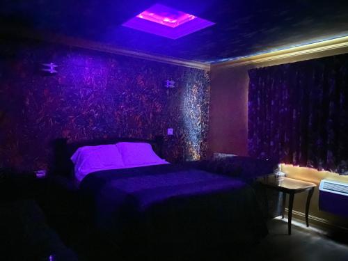 Letto o letti in una camera di Villa Park Motel