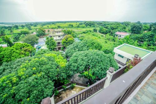 a view from a balcony of a house with trees at Villa Esmeralda Bryan's Resort Hotel and Restaurant in Palayan City