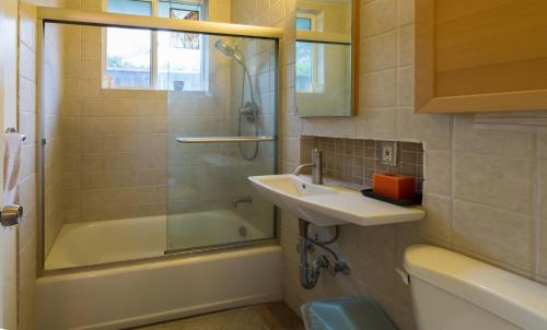 a bathroom with a sink and a shower and a tub at Private Room with Shared Bath in Mountain View