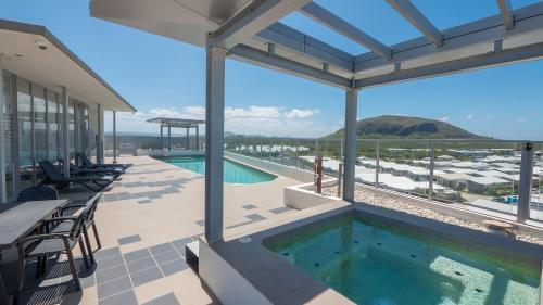 a view of a swimming pool on a house at White Shells Luxury Apartments Marcoola in Marcoola