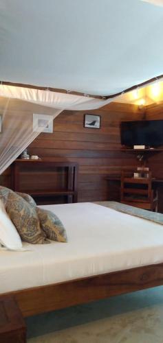 a bunk bed with two pillows on top of it at Idylle Beach in Sainte Marie