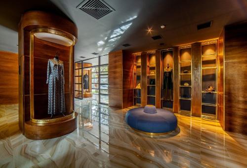 a fashion store with a dress in a display case at Folk Boutique Hotel in Tbilisi City