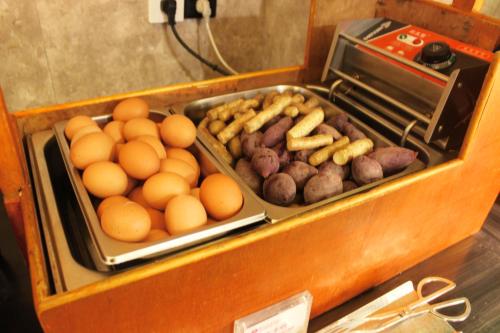 a box of food with eggs and meat and mushrooms at Ramada Changzhou North Hotel in Changzhou
