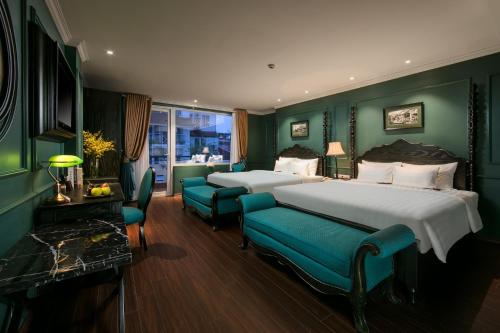 Giường trong phòng chung tại Grande Collection Hotel & Spa