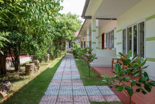 a walkway in front of a house at Trung Huynh Bungalow in Phu Quoc