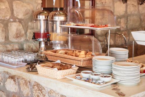 a buffet with bread and pastries on a table at Agama Lodge in Solitaire