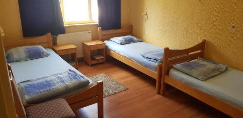 Postel nebo postele na pokoji v ubytování Hostel AV Palanka