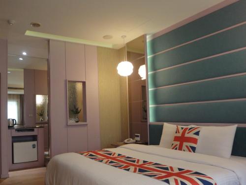 Postel nebo postele na pokoji v ubytování 伊都旅店 Motel