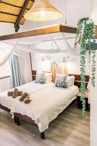 a bedroom with two beds with towels on them at Okahandja Country Hotel in Okahandja