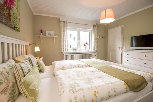 A bed or beds in a room at Ferienhaus Maison Idylle im Hohen Venn - Monschau