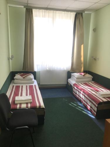 Ένα ή περισσότερα κρεβάτια σε δωμάτιο στο Hotel 18