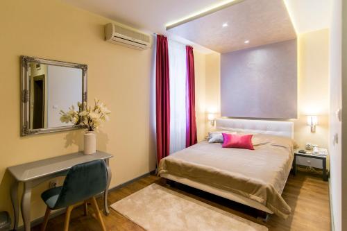 Krevet ili kreveti u jedinici u okviru objekta Garni Hotel Mediteraneo
