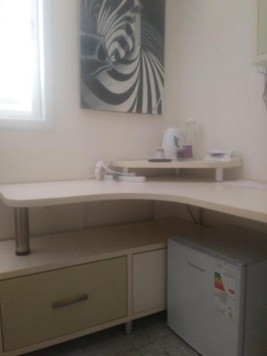 a kitchen with a counter and a sink at Namaste in Tel Aviv