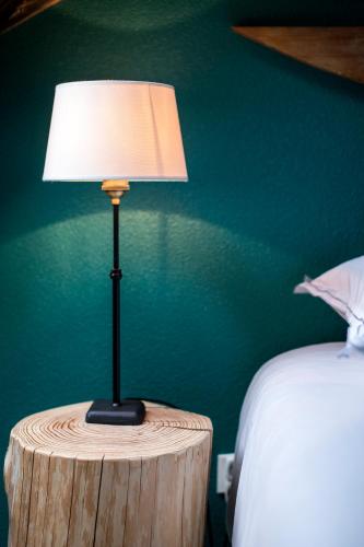 Postel nebo postele na pokoji v ubytování Gîte de l Ange - Au cœur du Centre Ville