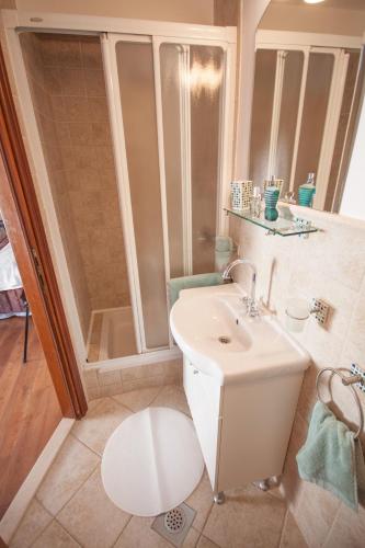 a bathroom with a sink and a shower at 22 THE STRADUN in Dubrovnik