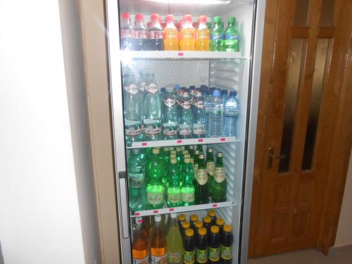 a refrigerator filled with lots of different types of drinks at Hotel Star in Akhaltsikhe