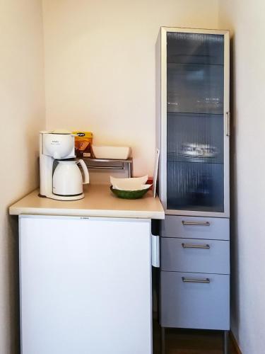 a kitchen with a counter top with a appliance at Almbauernhof in Ruhpolding