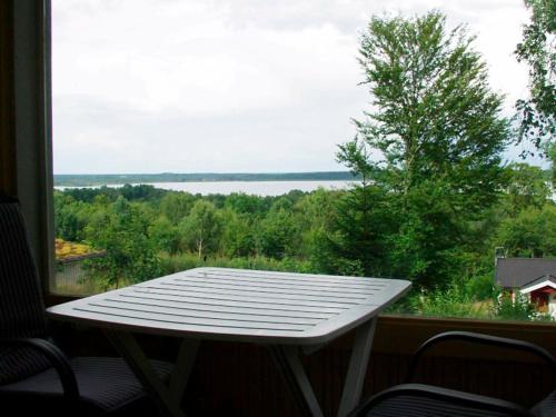 a white table in front of a window with a view at 2 person holiday home in TYRINGE-By Traum in Tyringe