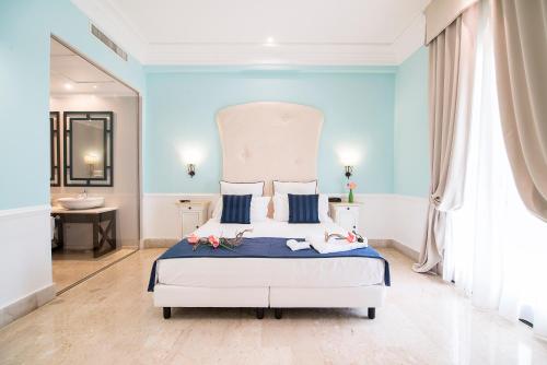 Ένα ή περισσότερα κρεβάτια σε δωμάτιο στο Hotel Baglio Basile