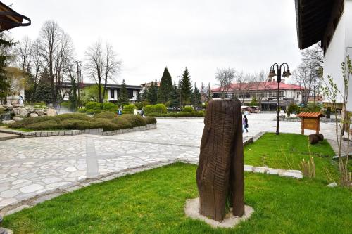 a statue in the middle of a park at Hotel Alpin - 91 Bansko in Bansko