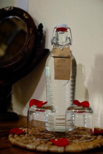 a bottle of water sitting on top of a pizza at Rivertrees Country Inn in Usa River