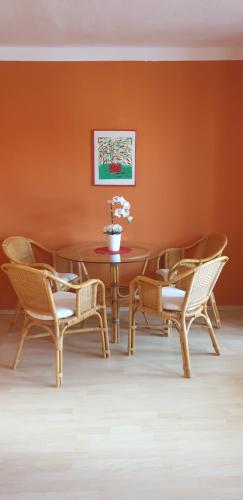a dining room with a table and chairs at Gasthaus Pavillon in Dresden