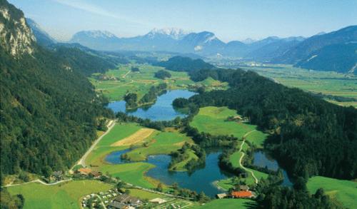 an aerial view of a lake in the mountains at Freundsheimhof in Kramsach