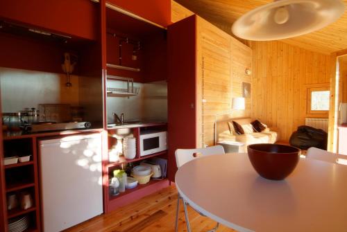 a kitchen with a table with a bowl on it at GoToGeres - Casa da Cerejeira - Casas de Alem in Arcos de Valdevez
