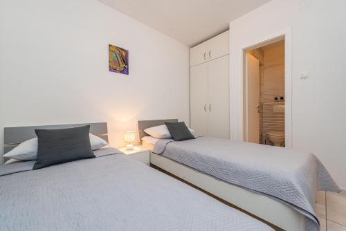 Postel nebo postele na pokoji v ubytování Star 6 modern & centrally ap for 6