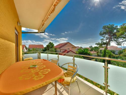 a balcony with a table and chairs and a view at Apartment Lidija by Interhome in Vir