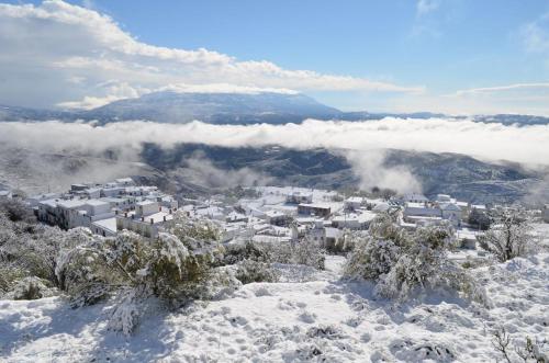 a town in the snow on a mountain at Casa Mamica Rosario in Yegen
