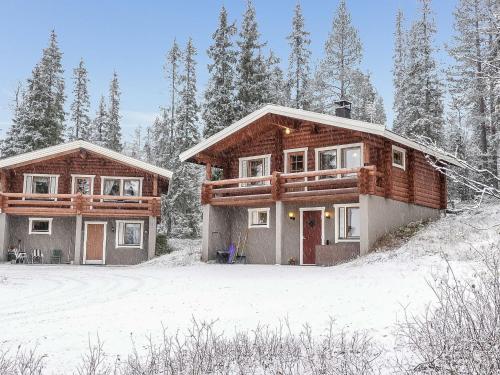 a log home in the snow with at Holiday Home Oloskammi 5 by Interhome in Muonio