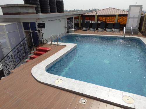 a swimming pool on top of a building at Safyad Hotel in Yaoundé