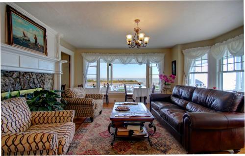 a living room with a couch and a table at Terrace By The Sea in Ogunquit