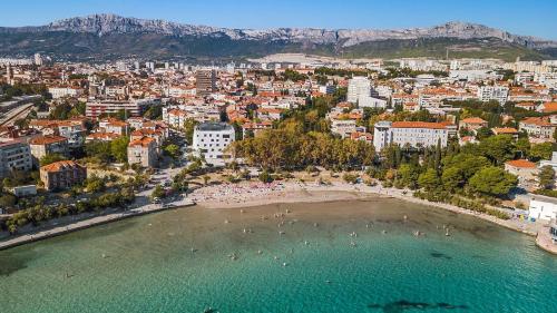 an aerial view of a city with a beach at Villa Muller Apartments in Split