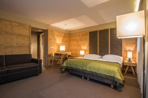 Postel nebo postele na pokoji v ubytování Hotel Arlara