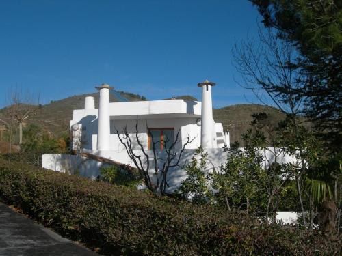 a white house sitting on top of a hill at Villa Turística de Laujar de Andarax in Laujar de Andarax