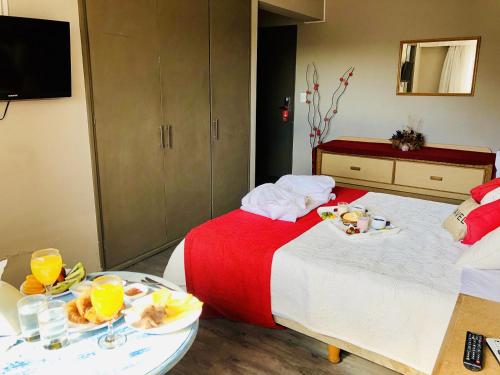 Giường trong phòng chung tại Hotel Azul by MH