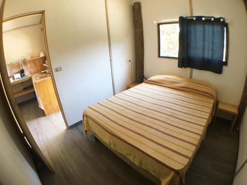 Postel nebo postele na pokoji v ubytování Santeria Lodge