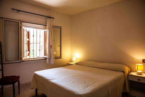 Posteľ alebo postele v izbe v ubytovaní Casa vacanze a 200 mt dalla spiaggia di Ottiolu - fpo1 e fp02