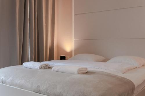 Tempat tidur dalam kamar di B&B Concept