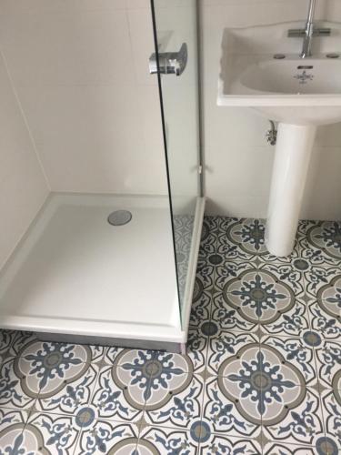 a bathroom with a sink and a toilet at Jules en ville 1 in Bastogne