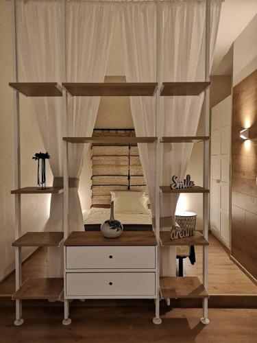 a bedroom with a bunk bed with a desk at Capuccino in Sofia