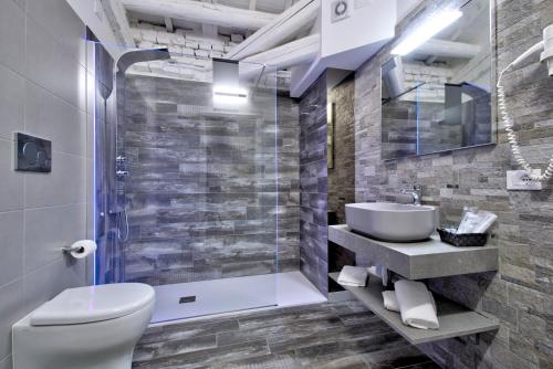 a bathroom with a toilet and a sink and a shower at Resilienza in Mira