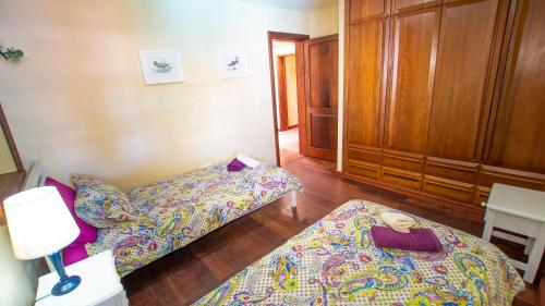 a room with two beds and a book on the floor at Villa Ana in Costa Teguise