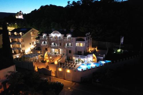 an aerial view of a large building at night at Boutique Hotel Kredo in Herceg-Novi