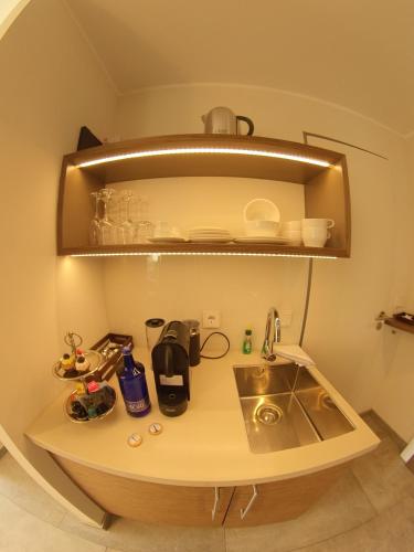 a kitchen with a sink and a counter top at MeerBlickD21 in Norderney