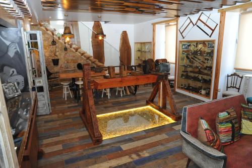 a living room with a wooden table and chairs at Hostel O Torneiro in Pernes