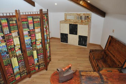 a room with a bunch of books on the wall at Hostel O Torneiro in Pernes